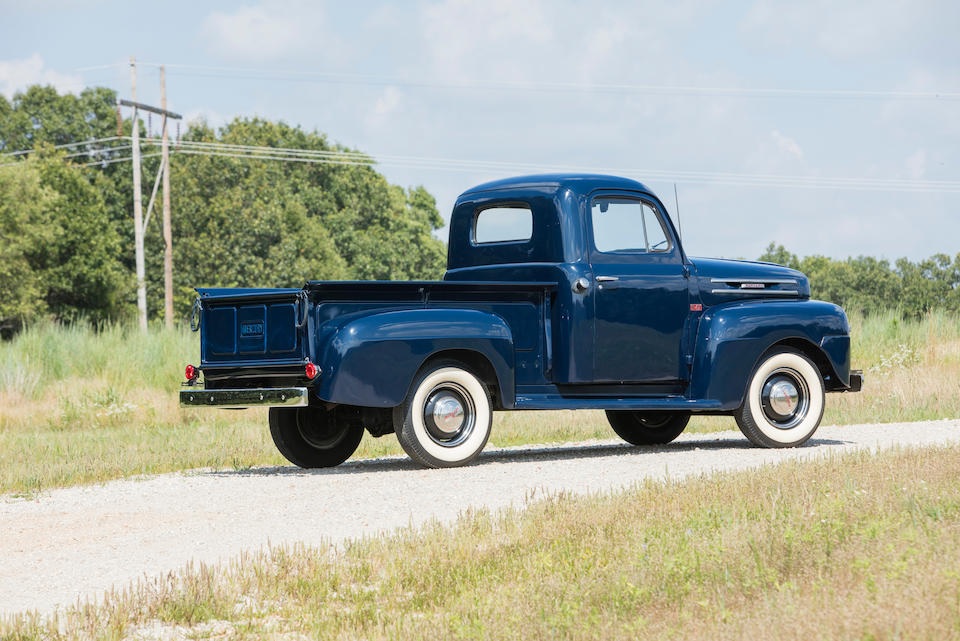 Dark blue 1949 Mercury pickup truck with whitewall tires, side-rear view