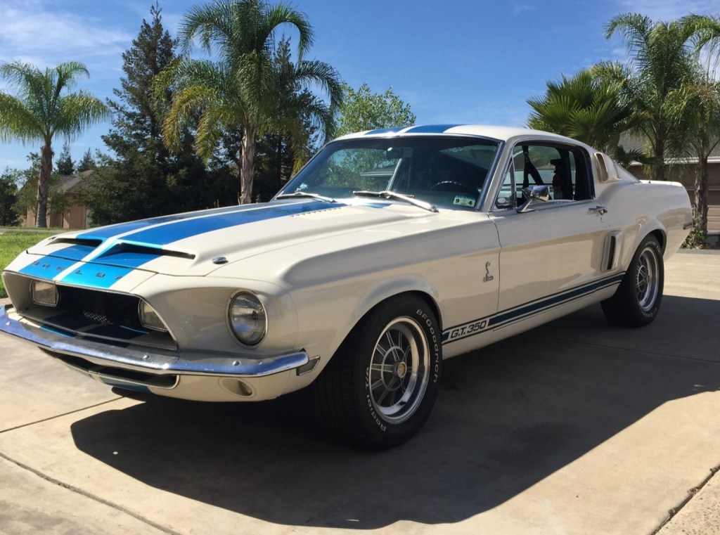 1968 supercharged Ford Shelby GT350 Mustang with white paint and blue racing stripes