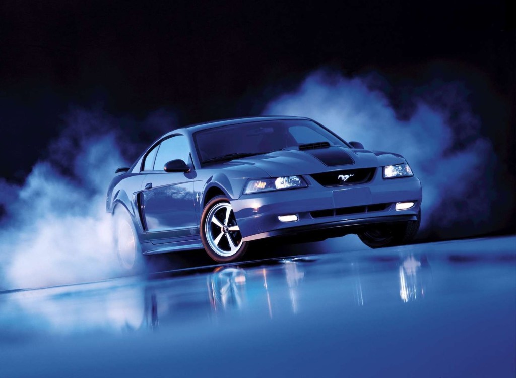 Blue 2003 Ford Mustang Mach 1 doing a burnout