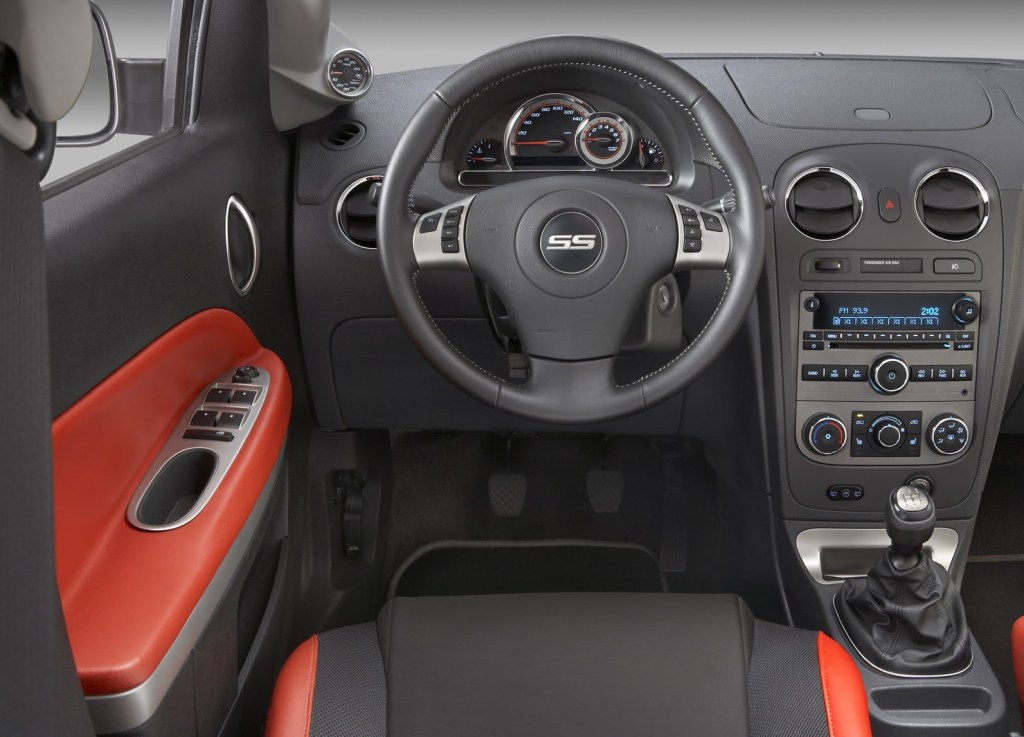 2008 Chevrolet HHR SS' black interior, showing 5-speed manual and red interior trim