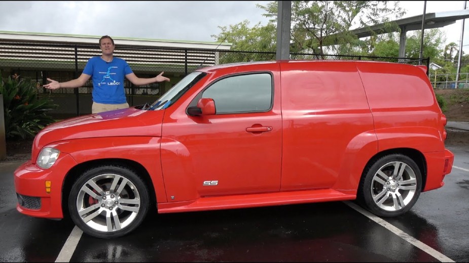 Red 2009 Chevrolet HHR SS wagon panel van version, side view, with Doug Demuro behind it