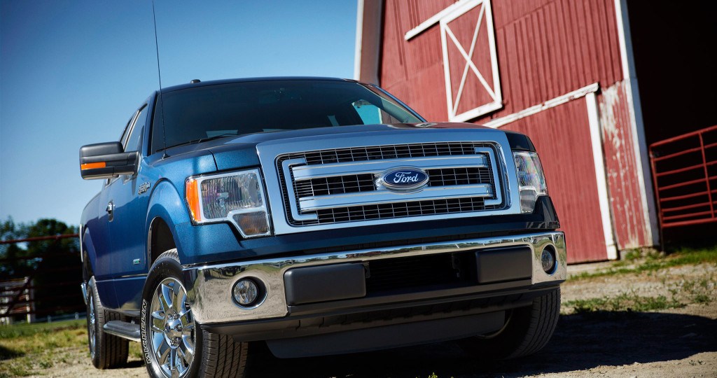 The 2014 Ford F-150 parked near a barn