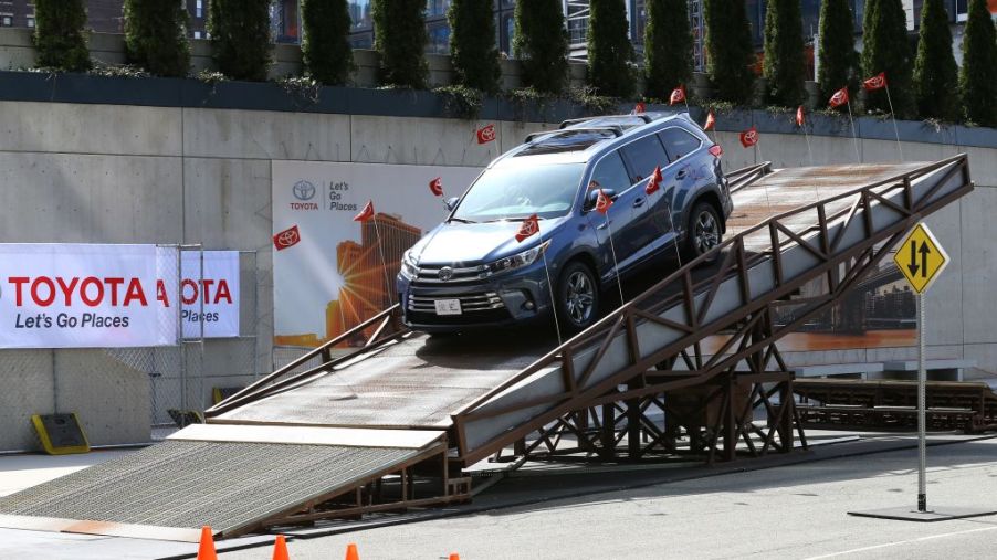 A 2017 Toyota Highlander being rolled off of a flatbed