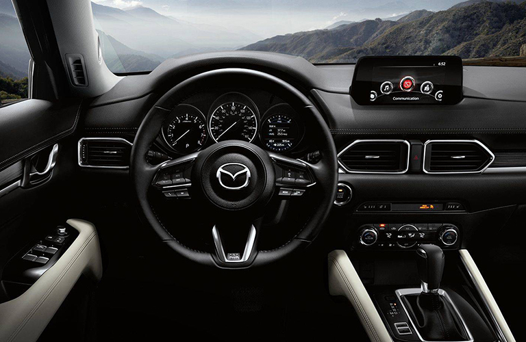 The interior of the 2018 CX-5 features of mix of upscale finshings and trimmings.