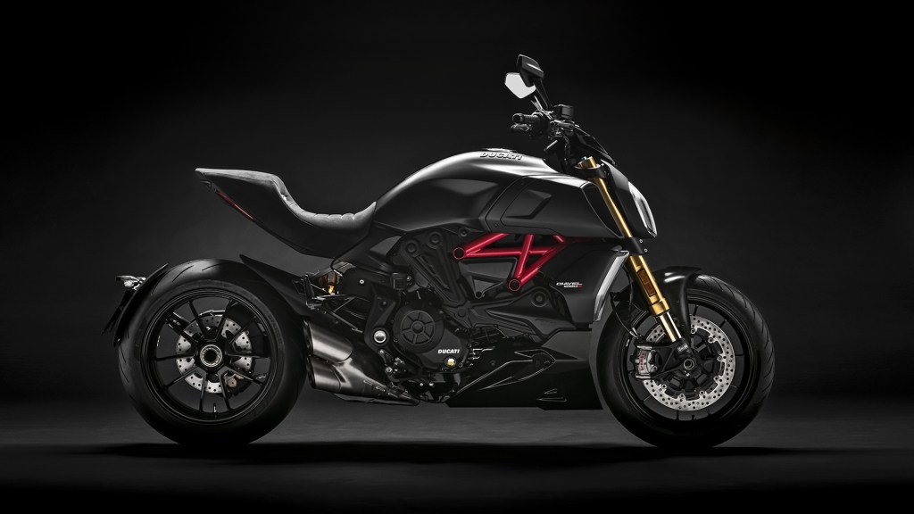 Black 2019 Ducati Diavel 1260, side view, against a black background
