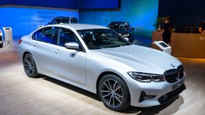 A 2020 BMW 3 Series on display at an auto show
