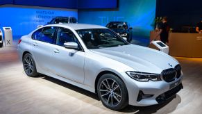 A 2020 BMW 3 Series on display at an auto show