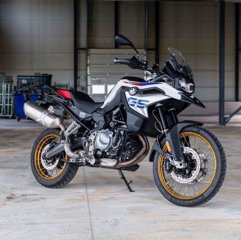 2020 BMW F 850 GS Adventure with white, red, and blue livery parked in hangar