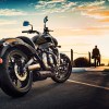Side-rear view of a black-and-gold 2020 Kawasaki Vulcan S, parked in front of the setting sun