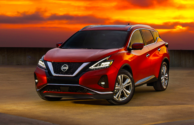 A red 2020 Nissan Murano crossover parked out in a desert, a winner pf the J.D. Power quality award.