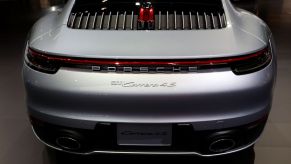 A 2020 Porsche 911 Carrera on display at an auto show