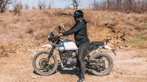 Rider sitting on 2020 Royal Enfield Himalayan on a muddy road