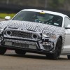 White-and-black camouflaged 2021 Ford Mustang Mach 1 testing on the racetrack