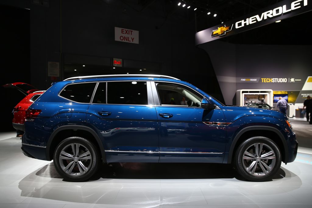 A blue Volkswagen Atlas on display at an auto show