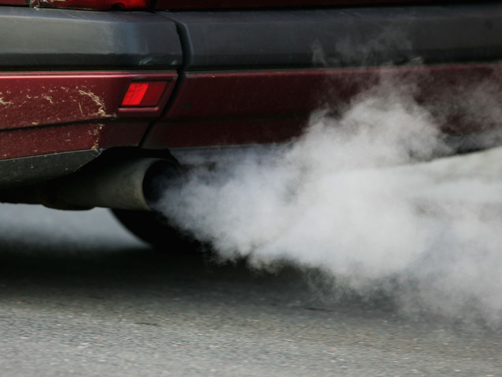 Car emissions coming from the tailpipe of a car