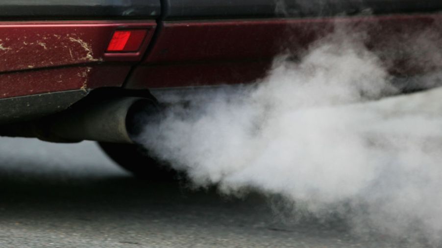 Car emissions coming from the tailpipe of a car