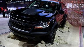 A black Chevrolet Colorado ZR2 on display at an auto show