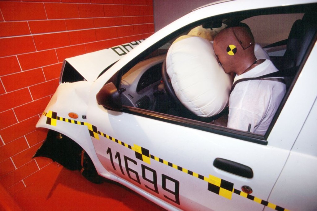 A crash test dummy and meets a deployed airbag