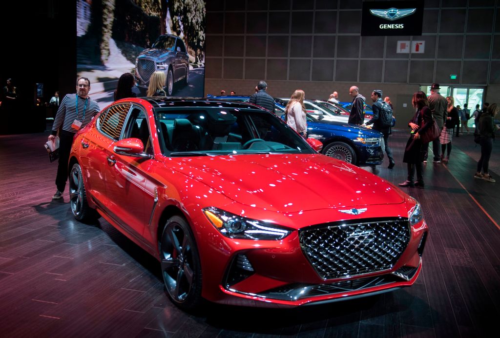 red genesis g70 at an auto show