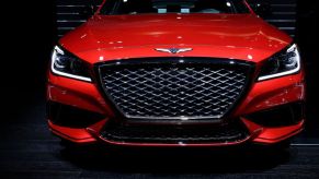 A front view of a Genesis G80 at an auto show