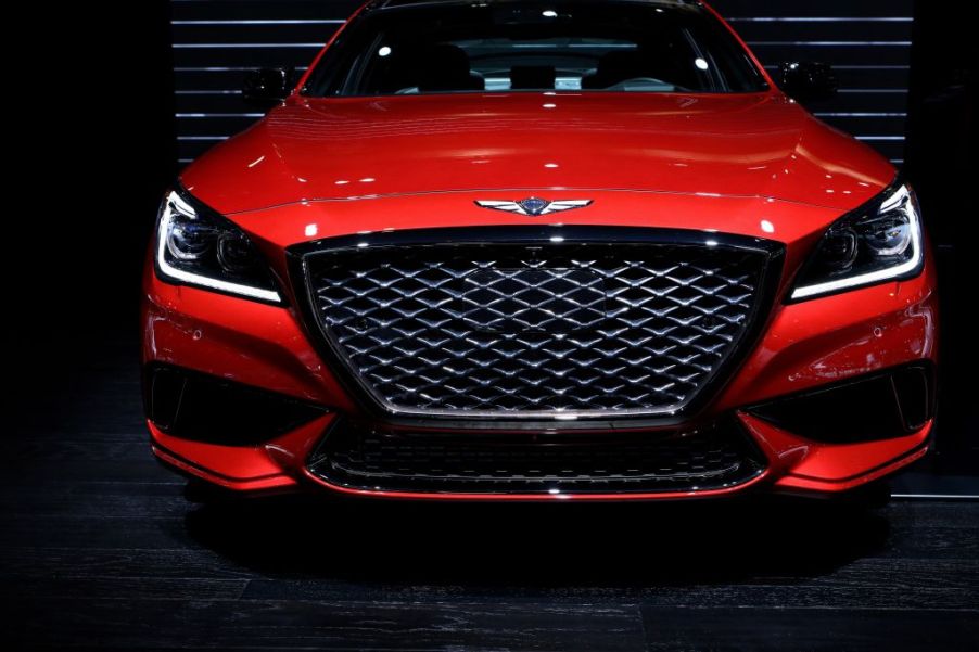 A front view of a Genesis G80 at an auto show