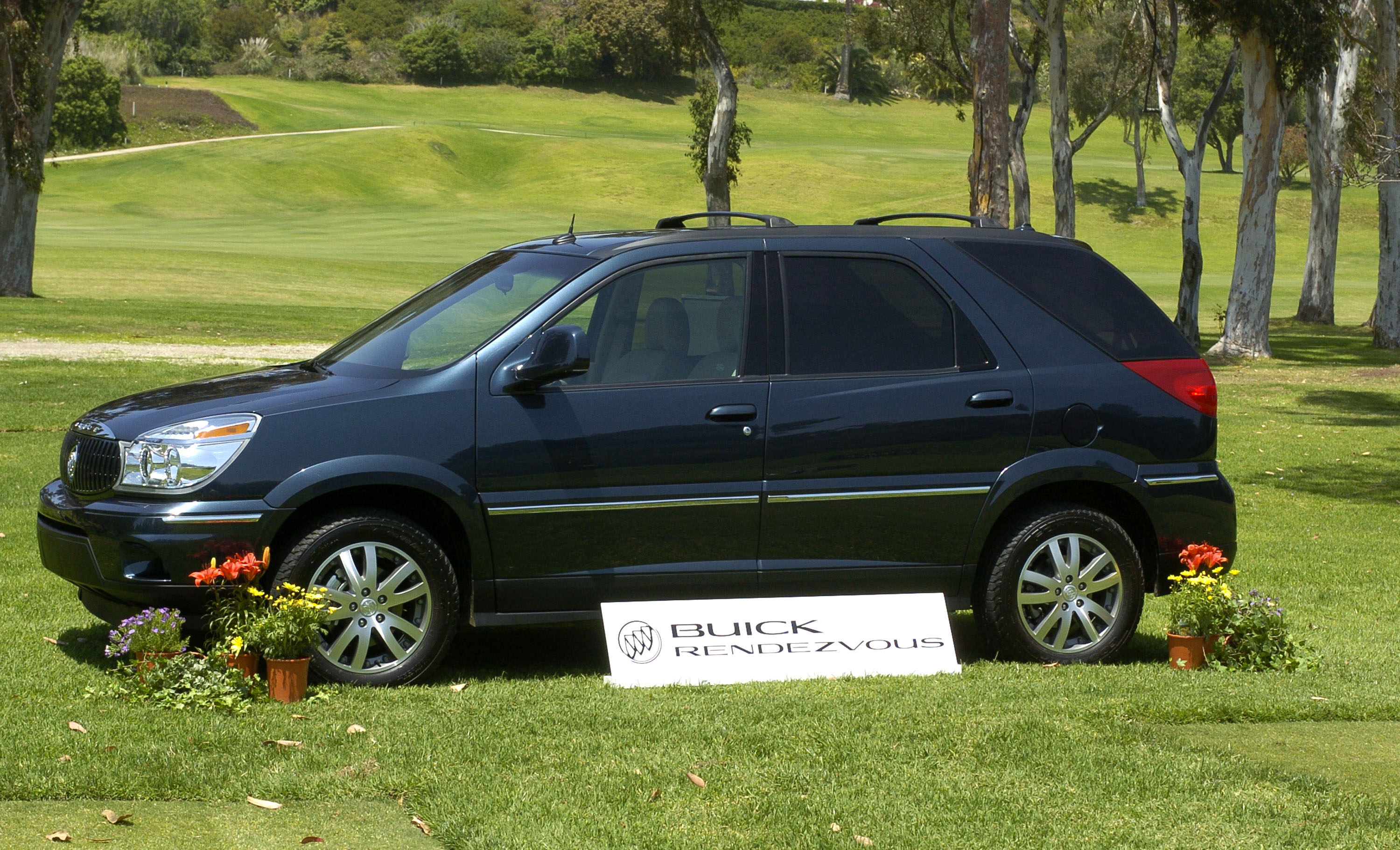 A Buick Rendezvous on display in the grass