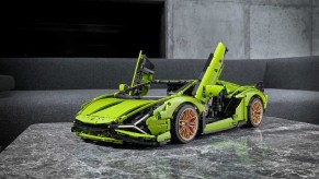 Green Lego Lamborghini Sian kit with gold wheels and open scissor doors