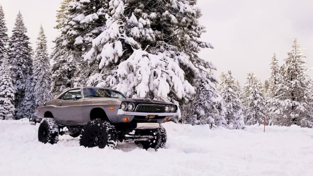 Lifted 1973 Dodge Challenger 4x4 in a snowy forest