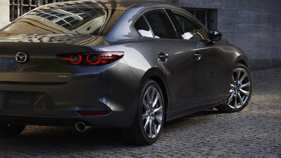 the rear view of a gray Mazda 3