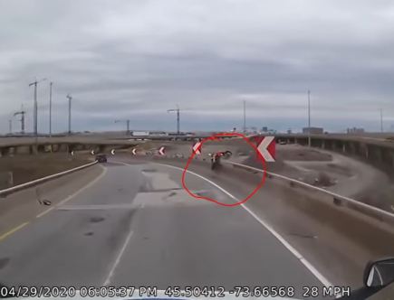 Motorcycle Rider Hits Barrier, Flies Over Railing