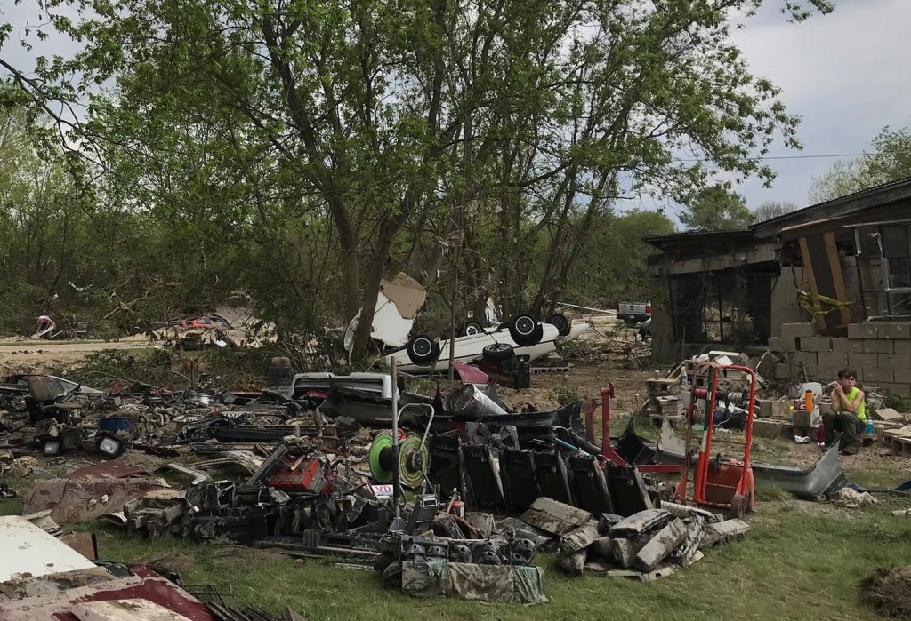 Pontiac Fiero parts strewn about from flood