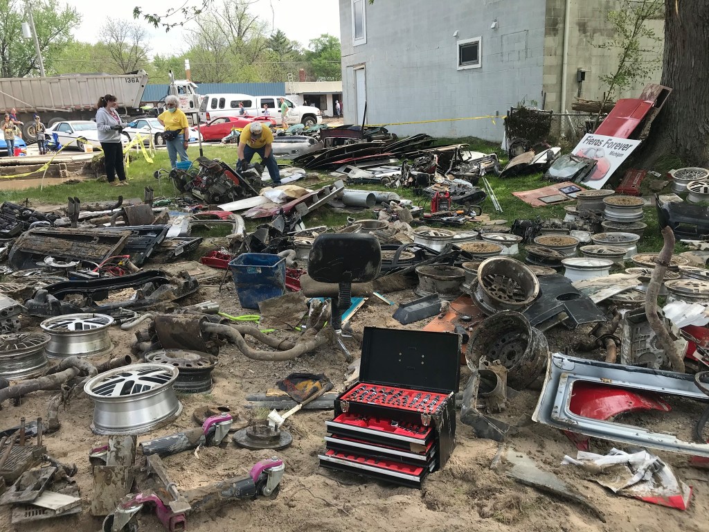 Pontiac Fiero parts strewn around from Michigan flood