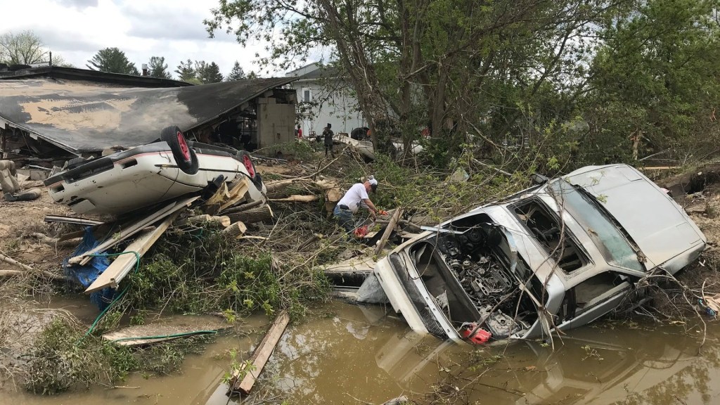 overturned Pontiac Fieros totaled in Michigan flood
