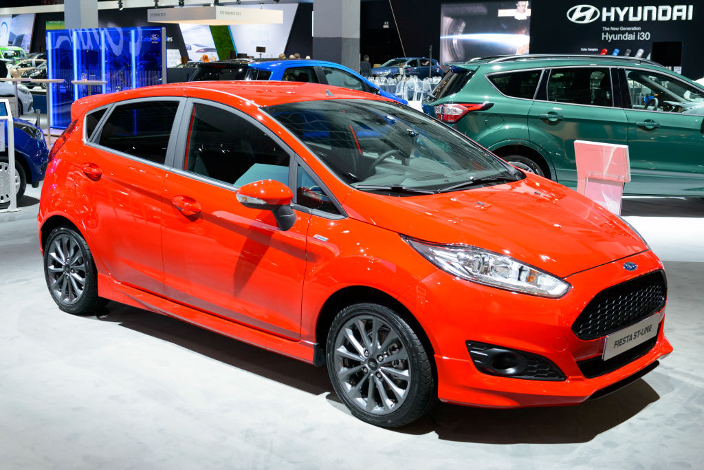A red Ford Fiesta on display at an auto show