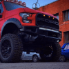 The red face of the 6x6 RaptorBus E-series overland mod
