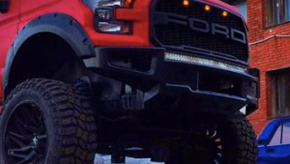 The red face of the 6x6 RaptorBus E-series overland mod