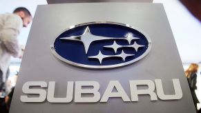 A sign displaying the Subaru logo on display