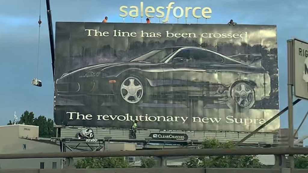 An old 1993 Toyota Supra advertisement on a billboard