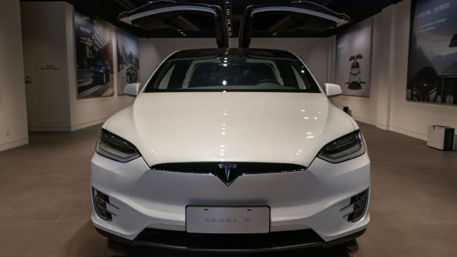 A white Tesla Model 3 on display