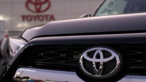 Toyota logo is seen on a Toyota 4Runner at its dealership in San Jose, California on August 27, 2019