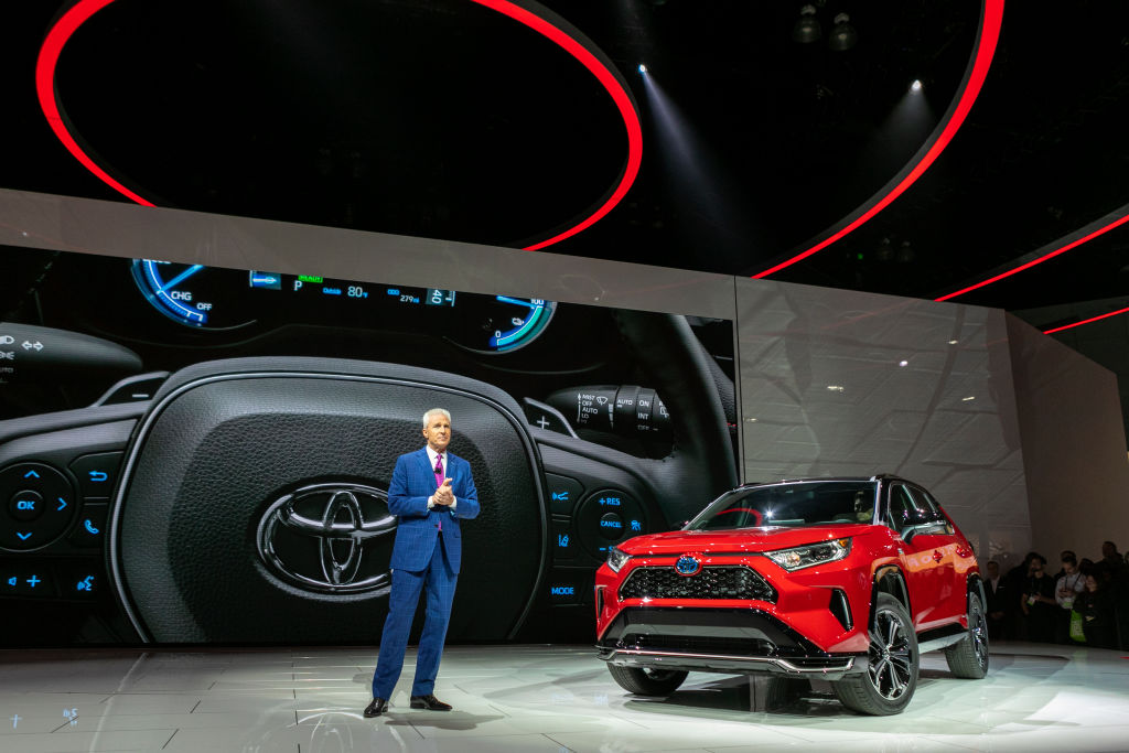 Toyota Motor North America Vice President and General Manager shows the Toyota RAV4 Hybrid at AutoMobility LA
