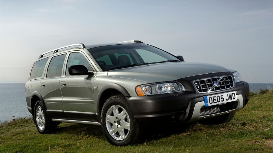 A Volvo XC70 parked on grass for display