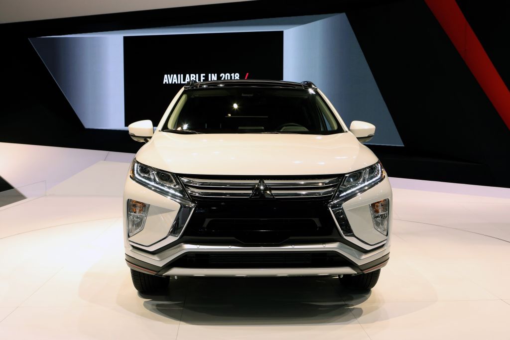A white Mitsubishi Eclipse Cross on display at an auto show