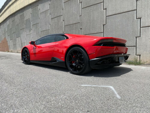 World's highest mileage Lamborghini Huracan in red sitting by the freeway