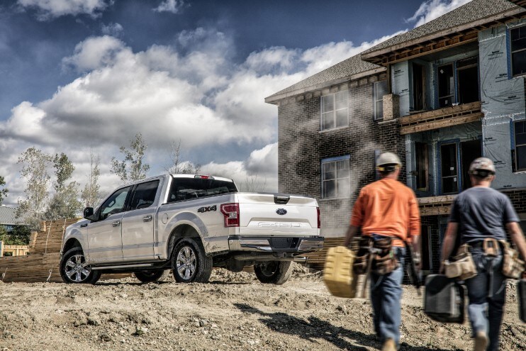 A white 2020 Ford F150 on a construction job