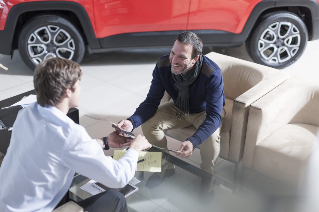 A car salesperson talking to a client 