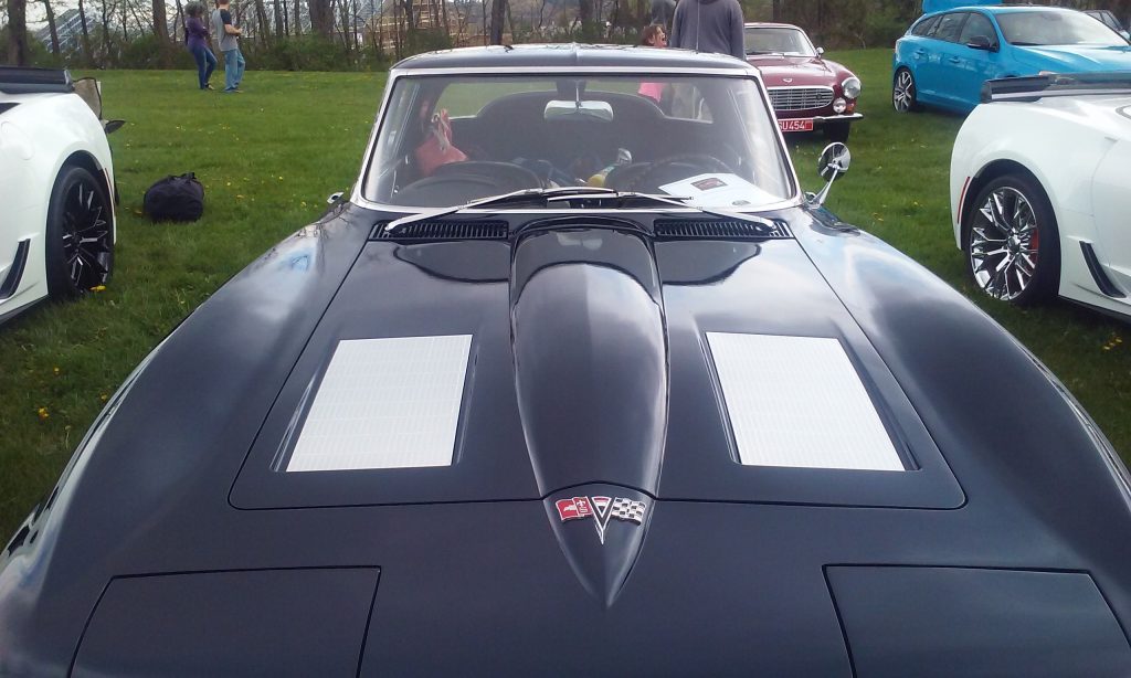 The vented black hood of a 1963 Chevrolet Corvette Sting Ray