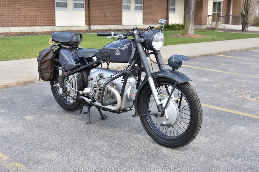 Blue-gray 1953 Condor A580 motorcycle in a parking lot