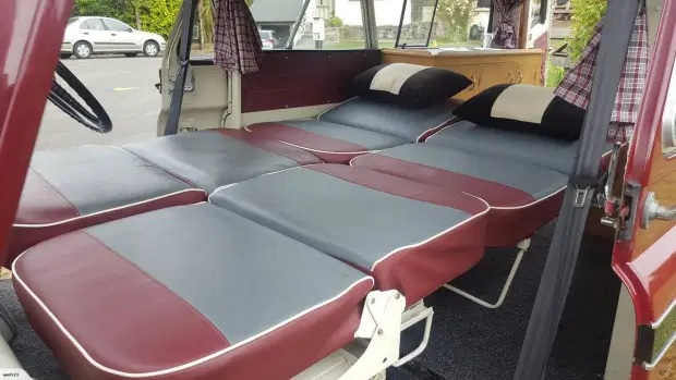 Maroon-and-grey front seats of the 1961 Bedford CA Dormobile folded down to serve as beds