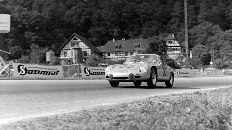 Black-and-white photo of the 1963 Porsche 356 Carrera GTL Abarth driving on a racetrack